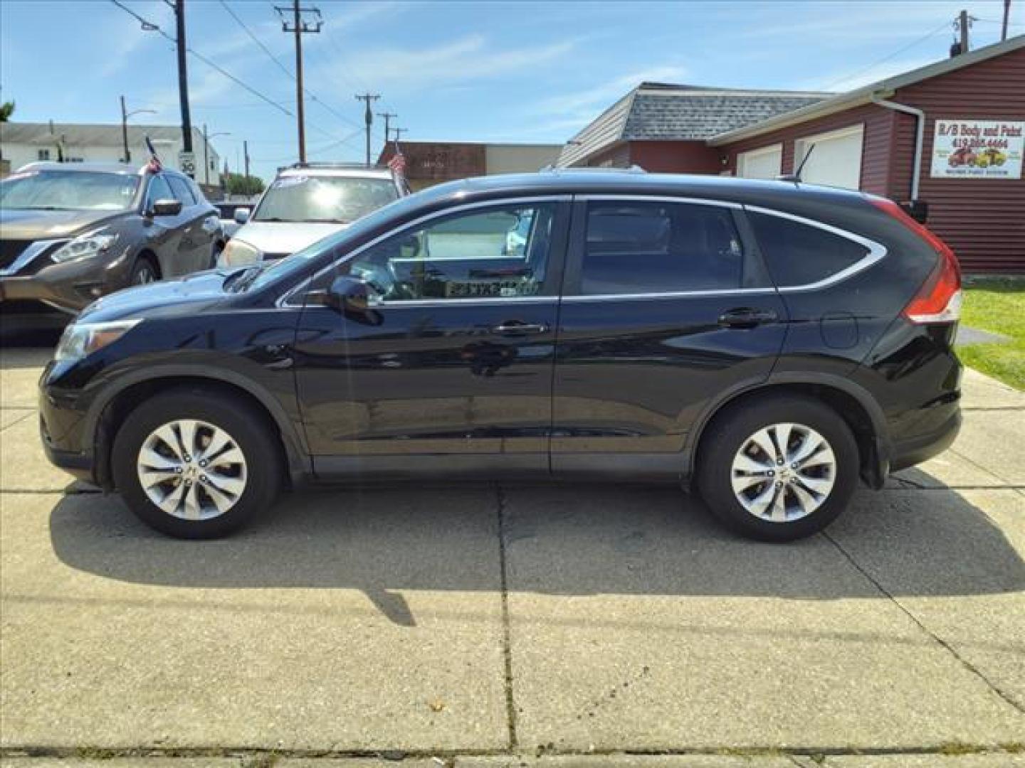 2014 Crystal Black Pearl Honda CR-V EX-L (2HKRM4H71EH) with an 2.4L 2.4L I4 185hp 163ft. lbs. Sequential Multiport Fuel Injection engine, 5-Speed Automatic transmission, located at 5505 N. Summit St., Toledo, OH, 43611, (419) 729-2688, 41.654953, -83.530014 - Photo#22