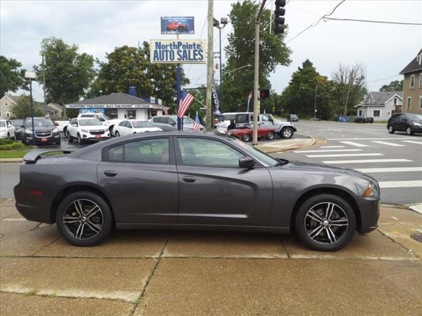 2014 Granite Crystal Metallic Clear Coat Dodge Charger AWD SXT Plus (2C3CDXJG0EH) with an 3.6L Pentastar 3.6L V6 292hp 260ft. lbs. Sequential Multiport Fuel Injection engine, 8-Speed Shiftable Automatic transmission, located at 5505 N. Summit St., Toledo, OH, 43611, (419) 729-2688, 41.654953, -83.530014 - Photo#0