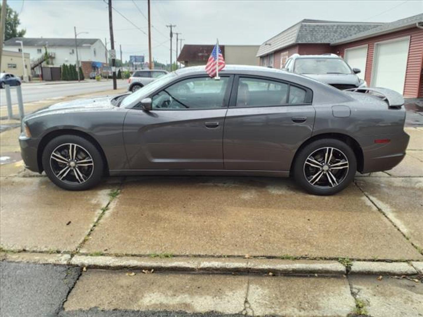 2014 Granite Crystal Metallic Clear Coat Dodge Charger AWD SXT Plus (2C3CDXJG0EH) with an 3.6L Pentastar 3.6L V6 292hp 260ft. lbs. Sequential Multiport Fuel Injection engine, 8-Speed Shiftable Automatic transmission, located at 5505 N. Summit St., Toledo, OH, 43611, (419) 729-2688, 41.654953, -83.530014 - Photo#23