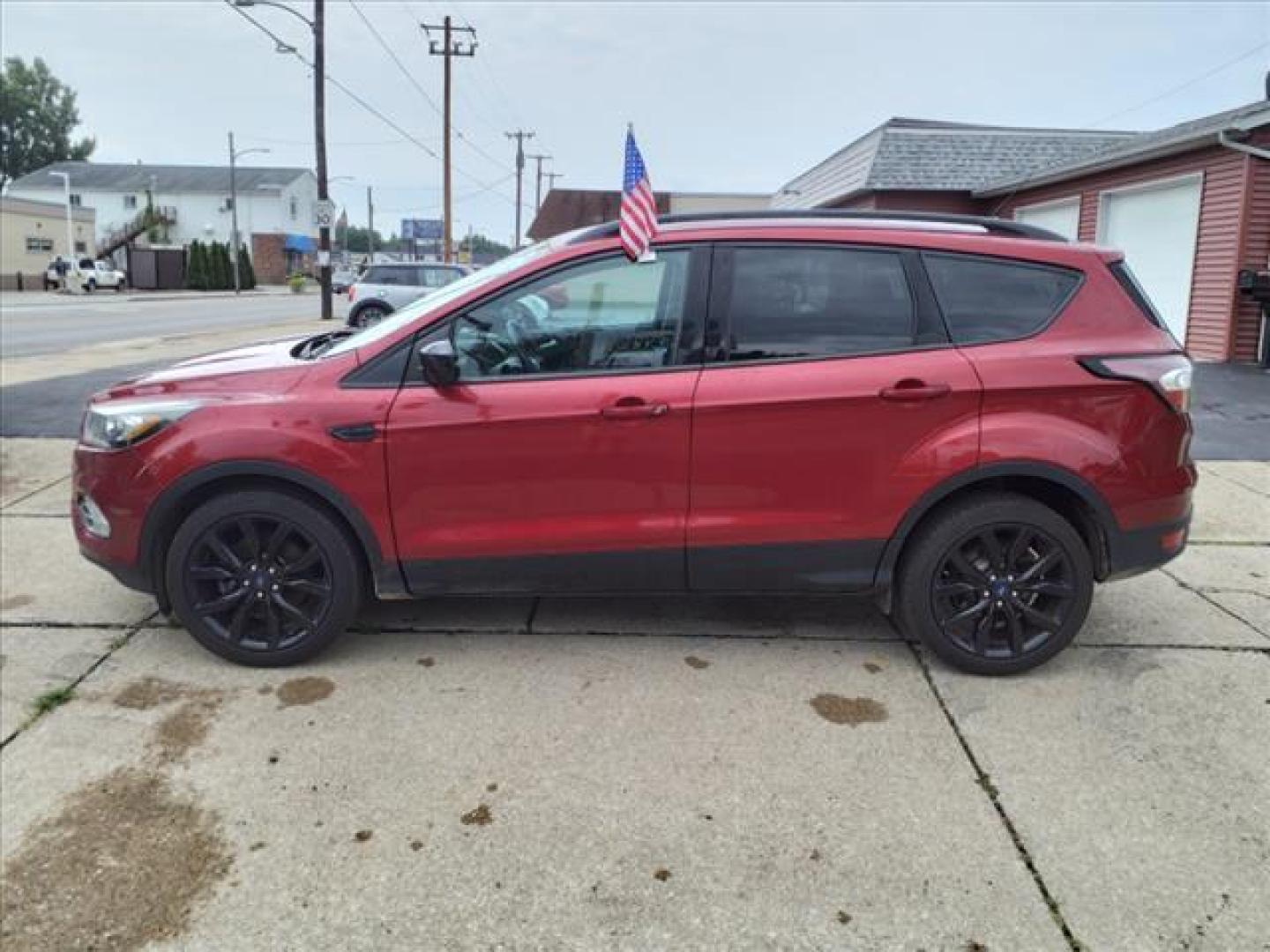 2017 Ruby Red Metallic Tinted Clearcoat Ford Escape SE (1FMCU0G95HU) with an 2.0L EcoBoost 2.0L Turbo I4 245hp 275ft. lbs. Direct Injection engine, 6-Speed Shiftable Automatic transmission, located at 5505 N. Summit St., Toledo, OH, 43611, (419) 729-2688, 41.654953, -83.530014 - Photo#22