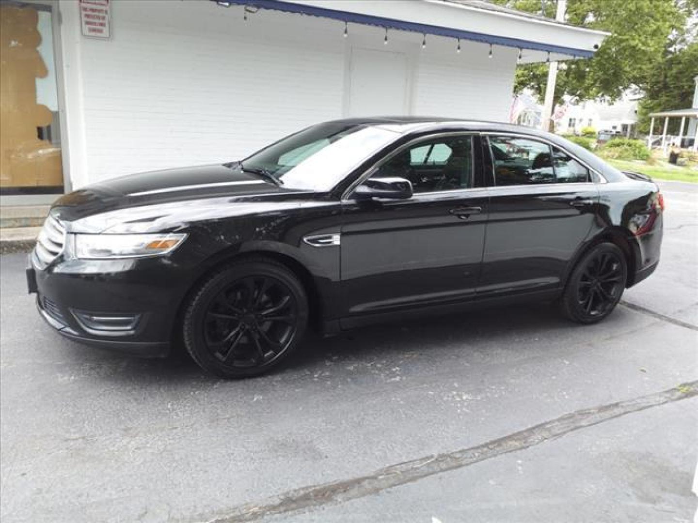 2013 Tuxedo Black Metallic Ford Taurus AWD SEL (1FAHP2H8XDG) with an 3.5L 3.5L V6 288hp 254ft. lbs. Sequential Multiport Fuel Injection engine, 6-Speed Shiftable Automatic transmission, located at 5505 N. Summit St., Toledo, OH, 43611, (419) 729-2688, 41.654953, -83.530014 - Photo#0