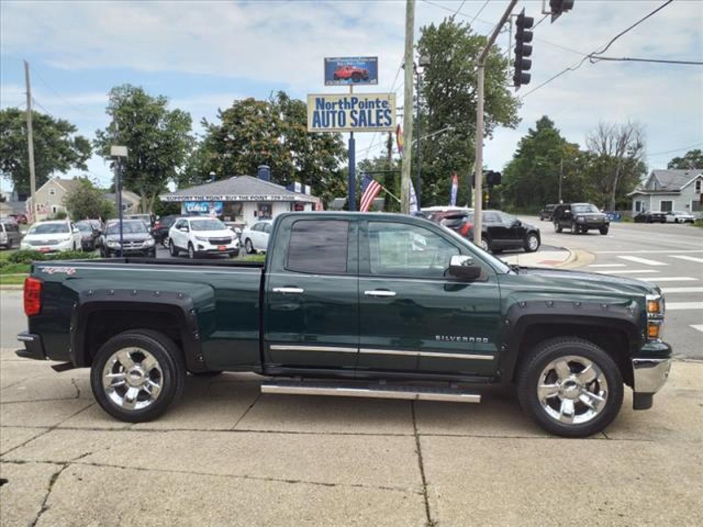 2014 Rainforest Green Metallic Chevrolet Silverado 1500 4x4 LTZ (1GCVKSEC0EZ) with an 5.3L EcoTec3 5.3L Flex Fuel V8 355hp 383ft. lbs. Direct Injection engine, 6-Speed Shiftable Automatic w/Overdrive transmission, located at 5505 N. Summit St., Toledo, OH, 43611, (419) 729-2688, 41.654953, -83.530014 - Photo#0