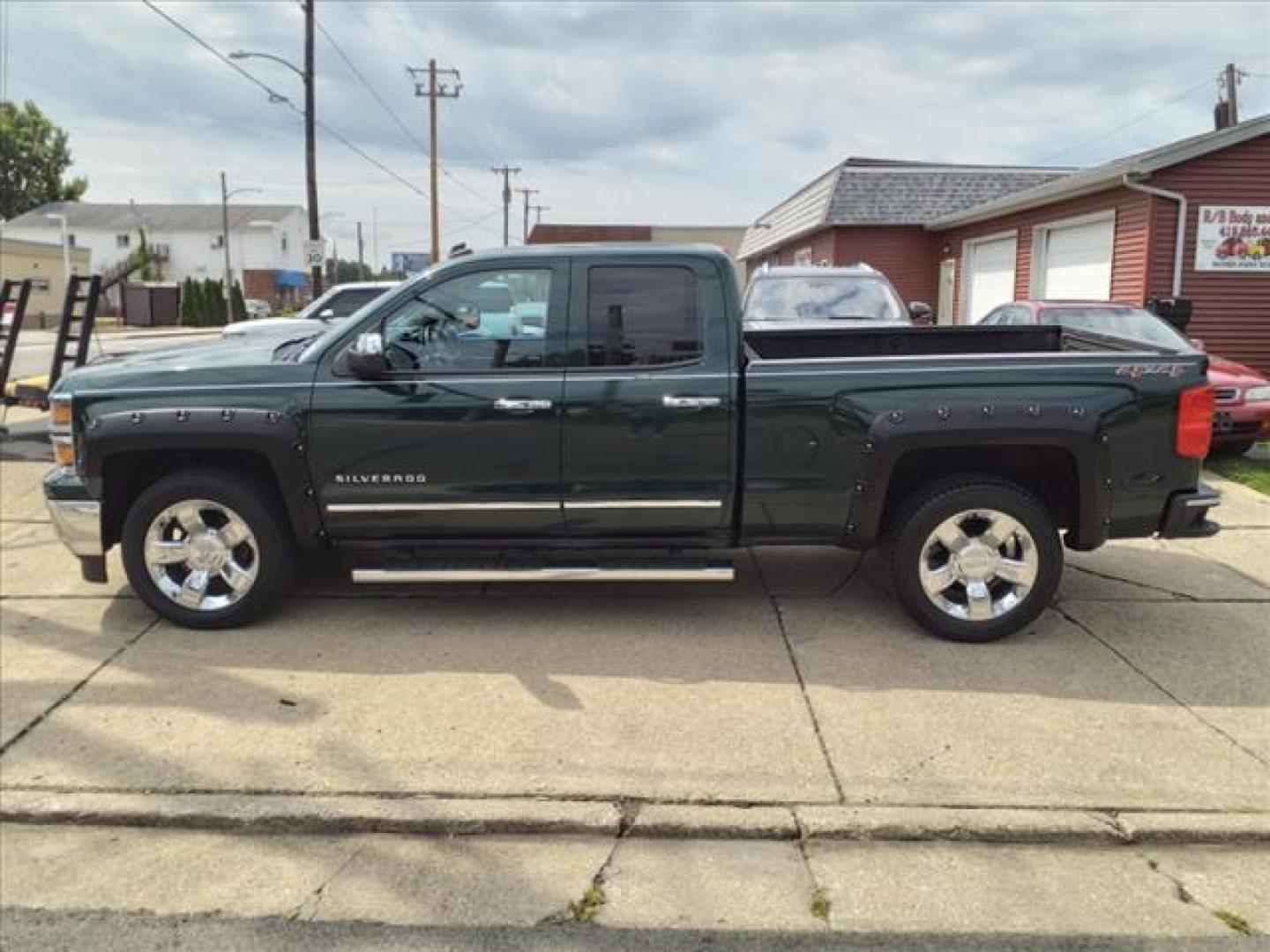 2014 Rainforest Green Metallic Chevrolet Silverado 1500 4x4 LTZ (1GCVKSEC0EZ) with an 5.3L EcoTec3 5.3L Flex Fuel V8 355hp 383ft. lbs. Direct Injection engine, 6-Speed Shiftable Automatic w/Overdrive transmission, located at 5505 N. Summit St., Toledo, OH, 43611, (419) 729-2688, 41.654953, -83.530014 - Photo#22