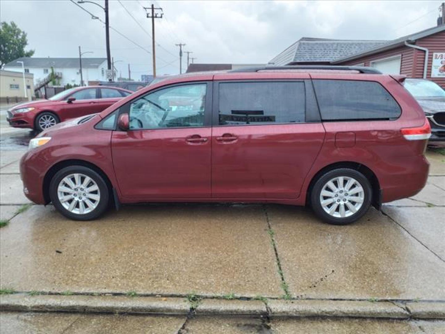 2012 Salsa Red Pearl Toyota Sienna AWD LE 7-Passenger (5TDJK3DC0CS) with an 3.5L 3.5L V6 266hp 245ft. lbs. Sequential Multiport Fuel Injection engine, 6-Speed Shiftable Automatic transmission, located at 5505 N. Summit St., Toledo, OH, 43611, (419) 729-2688, 41.654953, -83.530014 - Photo#20