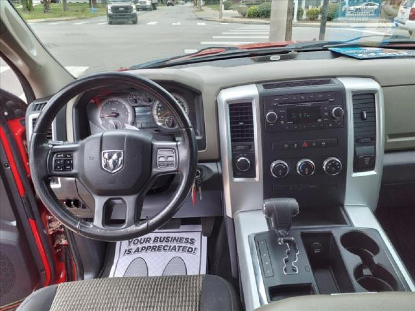 2012 Flame Red Clear Coat/Mineral Gray Metallic Clear C RAM 1500 4x4 Outdoorsman (1C6RD7LT9CS) with an 5.7L HEMI 5.7L V8 390hp 407ft. lbs. Sequential Multiport Fuel Injection engine, 6-Speed Automatic transmission, located at 5505 N. Summit St., Toledo, OH, 43611, (419) 729-2688, 41.654953, -83.530014 - Photo#4