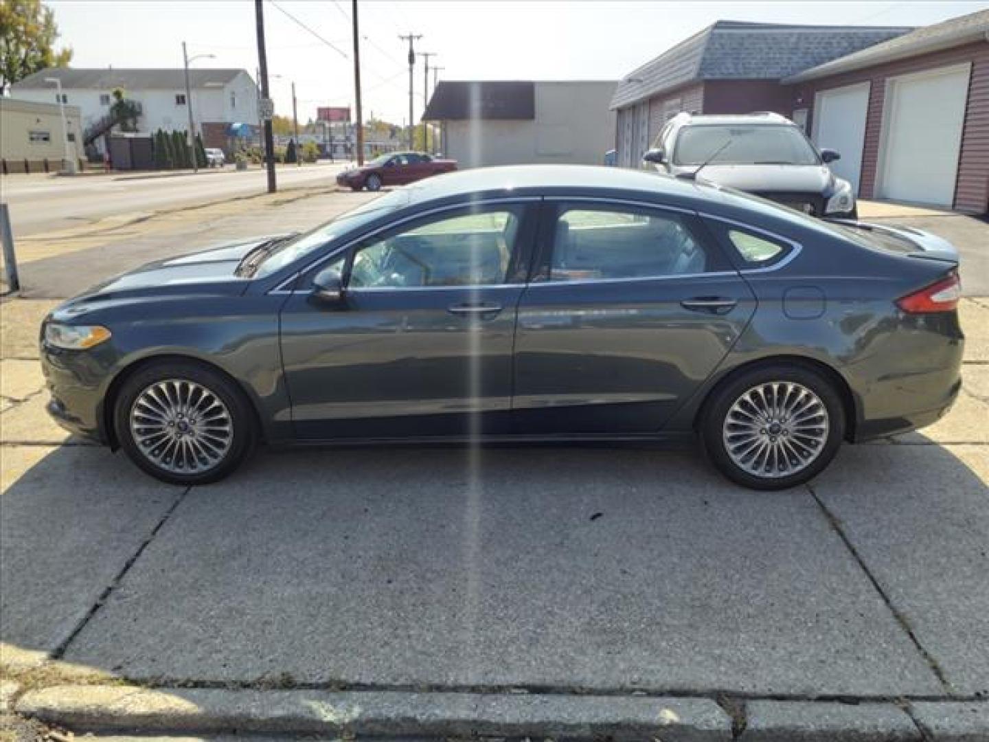 2016 Tectonic Ford Fusion Titanium (3FA6P0K90GR) with an 2.0L EcoBoost 2.0L Turbo I4 240hp 270ft. lbs. Direct Injection engine, 6-Speed Shiftable Automatic transmission, located at 5505 N. Summit St., Toledo, OH, 43611, (419) 729-2688, 41.654953, -83.530014 - Photo#20