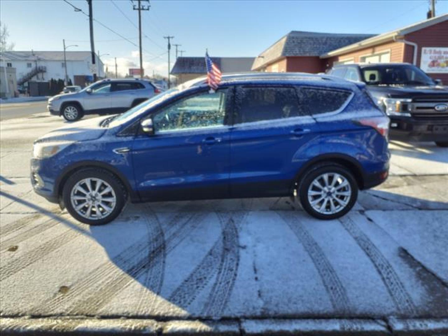 2017 Lightning Blue N6 Ford Escape Titanium (1FMCU0JDXHU) with an 1.5L EcoBoost 1.5L Turbo I4 179hp 177ft. lbs. Direct Injection engine, 6-Speed Shiftable Automatic transmission, located at 5505 N. Summit St., Toledo, OH, 43611, (419) 729-2688, 41.654953, -83.530014 - Photo#21