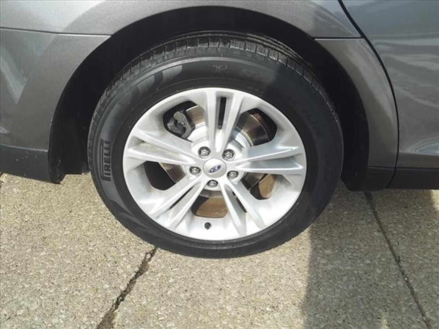 2014 Sterling Gray Metallic Uj Ford Taurus SEL (1FAHP2E88EG) with an 3.5L 3.5L V6 288hp 254ft. lbs. Sequential Multiport Fuel Injection engine, 6-Speed Shiftable Automatic transmission, located at 5505 N. Summit St., Toledo, OH, 43611, (419) 729-2688, 41.654953, -83.530014 - Photo#24