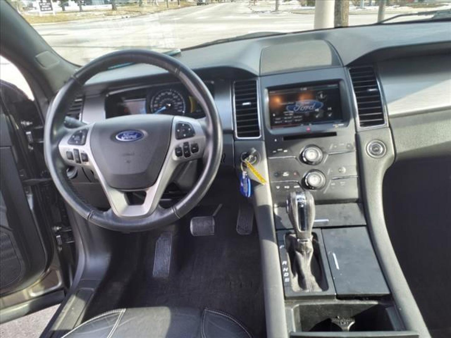 2014 Sterling Gray Metallic Uj Ford Taurus SEL (1FAHP2E88EG) with an 3.5L 3.5L V6 288hp 254ft. lbs. Sequential Multiport Fuel Injection engine, 6-Speed Shiftable Automatic transmission, located at 5505 N. Summit St., Toledo, OH, 43611, (419) 729-2688, 41.654953, -83.530014 - Photo#5