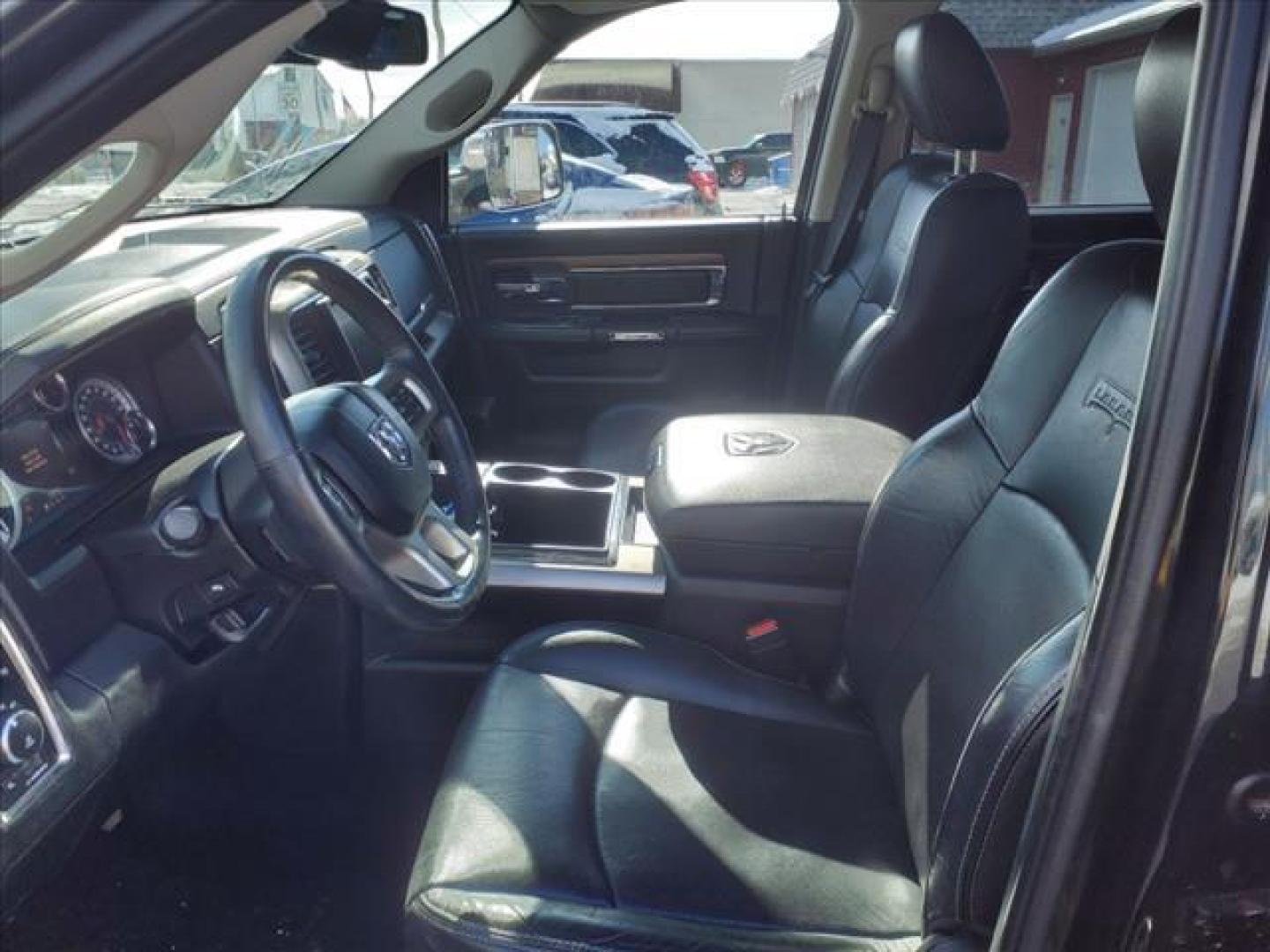 2015 Black Clear Coat/Bright Silver Metallic Clear Coat RAM 1500 4x4 Laramie (1C6RR7VT2FS) with an 5.7L HEMI 5.7L V8 395hp 410ft. lbs. Sequential Multiport Fuel Injection engine, 8-Speed Shiftable Automatic transmission, located at 5505 N. Summit St., Toledo, OH, 43611, (419) 729-2688, 41.654953, -83.530014 - Photo#2